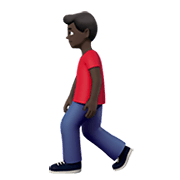 🚶🏿‍♂️ Emoji Hombre Caminando: Tono De Piel Oscuro en Apple iOS 14.2.