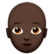 Emoji 🧑🏿‍🦲 Persona: Carnagione Scura E Calvo su Apple iOS 16.4.