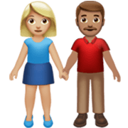 Émoji 👩🏼‍🤝‍👨🏽 Femme Et Homme Se Tenant La Main : Peau Moyennement Claire Et Peau Légèrement Mate sur Apple iOS 17.4.