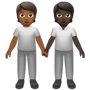 🧑🏾‍🤝‍🧑🏿 Emoji Dos Personas Dándose La Mano: Tono De Piel Oscuro Medio, Tono De Piel Oscuro en Apple iOS 17.4.