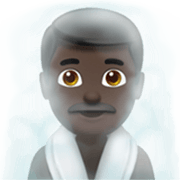 🧖🏿‍♂️ Emoji Hombre En Una Sauna: Tono De Piel Oscuro en Apple iOS 17.4.