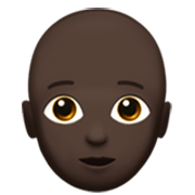 Emoji 🧑🏿‍🦲 Persona: Carnagione Scura E Calvo su Apple iOS 17.4.