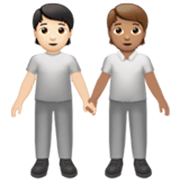 🧑🏻‍🤝‍🧑🏽 Emoji sich an den Händen haltende Personen: helle Hautfarbe, mittlere Hautfarbe Apple iOS 17.4.