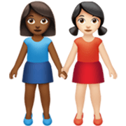 👩🏾‍🤝‍👩🏻 Emoji händchenhaltende Frauen: mitteldunkle Hautfarbe, helle Hautfarbe Apple iOS 17.4.