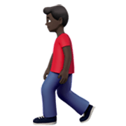 🚶🏿‍♂️ Emoji Hombre Caminando: Tono De Piel Oscuro en Apple iOS 17.4.