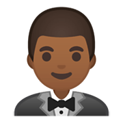 🤵🏾 Emoji Pessoa De Smoking: Pele Morena Escura na Google Android 10.0.