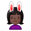 👯🏿‍♀️ Emoji Mujeres Con Orejas De Conejo, Tono De Piel Oscuro en Samsung Experience 9.0.