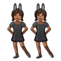 👯🏾‍♀️ Emoji Mujeres Con Orejas De Conejo, Tono De Piel Oscuro Medio en Samsung One UI 6.1.