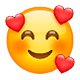 Emoji 🥰 Faccina Con Cuoricini su WhatsApp 2.19.7.